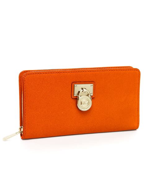 michael kors orange wristlet|Michael Kors oversized wallet.